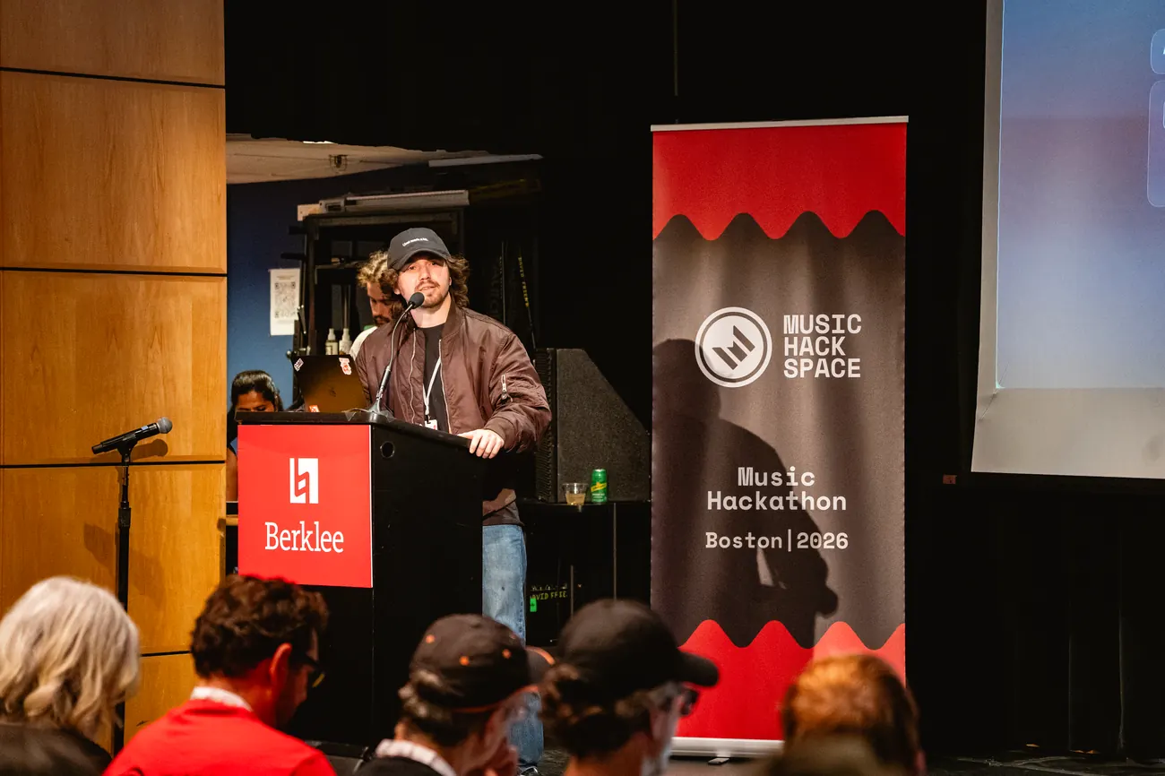 Javier Roqueni presenting AURALINK at the Berklee Music Hackathon podium